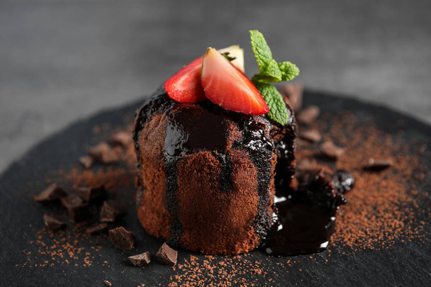 Delicious warm chocolate lava cake on slate board, closeup - Photo, Image
