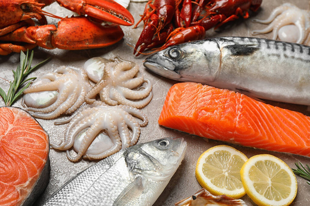 Fresh fish and seafood on marble table - Fotó, kép