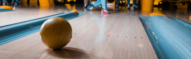 panoramic shot of bowling ball on skittle alley in bowling club - Fotografie, Obrázek