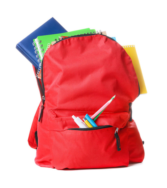 School backpack with stationery on white background - Photo, Image