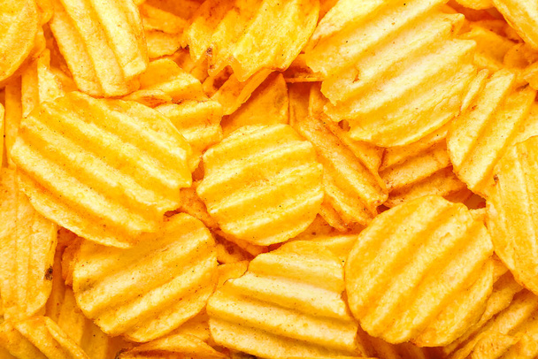 Tasty potato chips as background - Foto, imagen