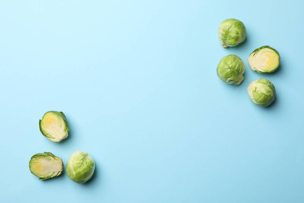 Brussels sprout on blue background, top view and space for text - 写真・画像
