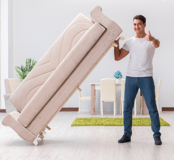Man moving furniture at home - Φωτογραφία, εικόνα