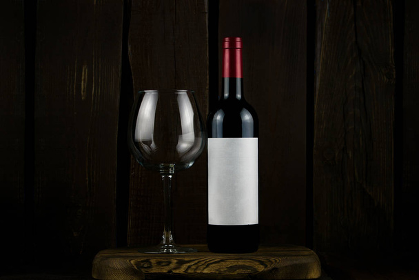 wine bottle and glass on wooden background - Photo, Image