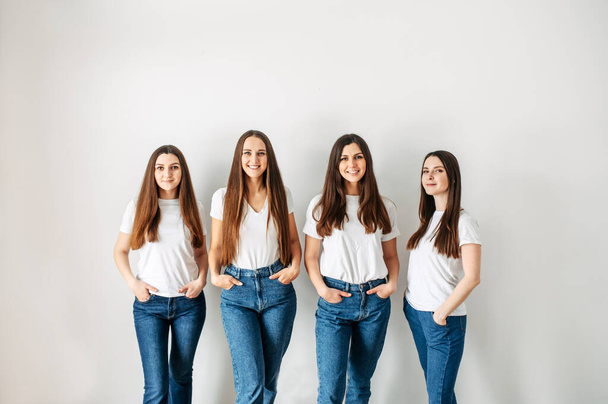 Group of young girls in casual wear in studio - Zdjęcie, obraz