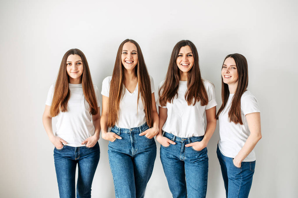 Group of young girls in casual wear in studio - 写真・画像