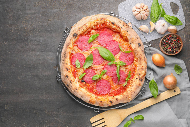 Tasty pizza on grey background - Photo, Image