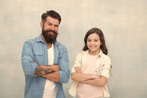 Father and daughter teammates. Parenthood and childhood. Fathers day concept. Trust and support. Best friends. Team of dad. Bearded hipster man and adorable child girl. We are team. Family team - 写真・画像