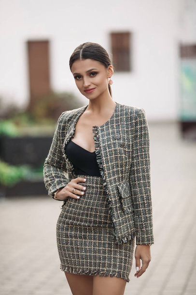 Beautiful young adult brunette in stylish look. - Foto, afbeelding