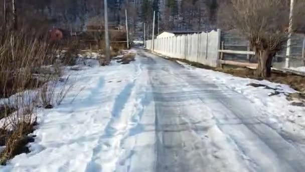 The drone collided with a pillar after flying over a snowy road. - Footage, Video