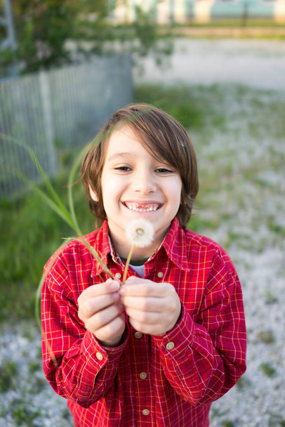 Child with dandelion in outside - Fotografie, Obrázek