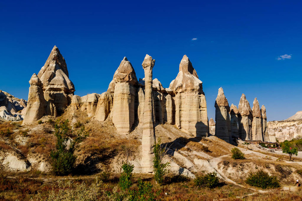 Stone pillars in the Love valley in in Goreme national park. Goreme village, Anatolia, Turkey, Asia. - 写真・画像