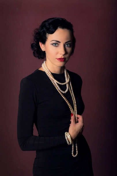 Portrait of a girl in the style of the golden 20s. - Photo, Image