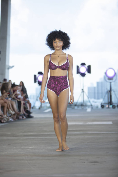 A model walks the runway for Acacia Swimwear Summer collection 2020 fashion show during Paraiso Swim Week 2019 at Miami Beach in the 11 11 Building on July 13th, 2019 - Photo, image