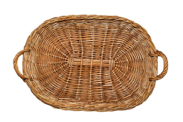Wicker basket with handles on the sides in the shape of a rectangle, flat top view, isolated on a white background with a clipping path. - Photo, Image