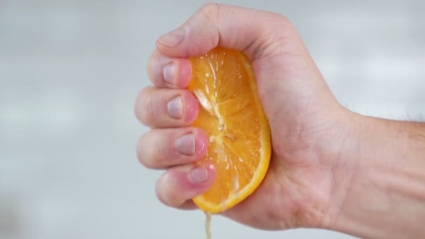 Orange in super slow motion being squeezed - Materiaali, video