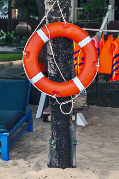 orange belt buoy emergency help lifebuoy beach - Photo, Image