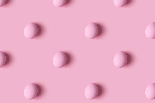 Pattern of pink Easter eggs over pink background - Valokuva, kuva