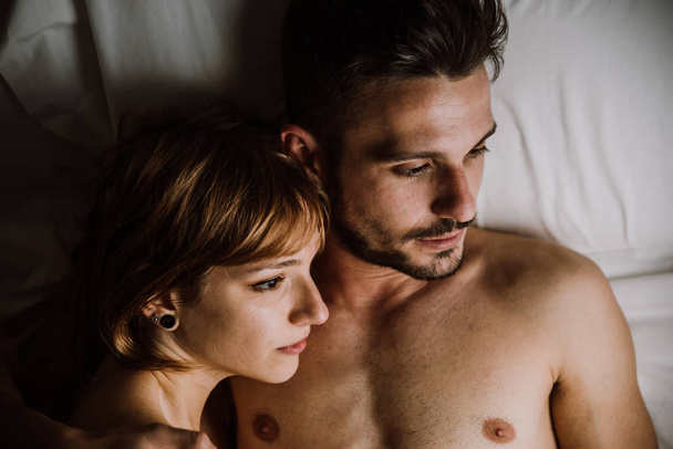 young couple relaxing in bed and having fun.  - Photo, Image