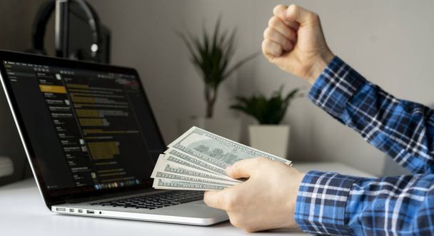 working at home. side hustle, person earned money via computer using the internet - 写真・画像