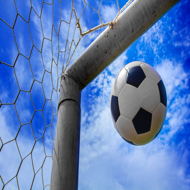 Soccer ball in goal - 写真・画像
