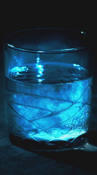 Glass of water on the black background - Φωτογραφία, εικόνα