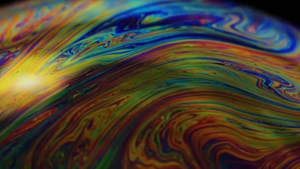 Soap bubble macro rainbow colors creating. Colorful foam soap bubble slow motion high cinematic quality (Red Dragon Camera). Very similar to other galaxy planets. You can use it in space films and etc - Video