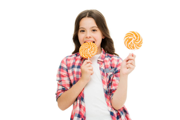 Sugar addiction. Healthy nutrition diet. Girl like sweets lollipop candy white background. Sweets reward. Rewarding herself with sweets. Food addictions. Girl kid eat sweet lollipop. Happy childhood - Photo, Image