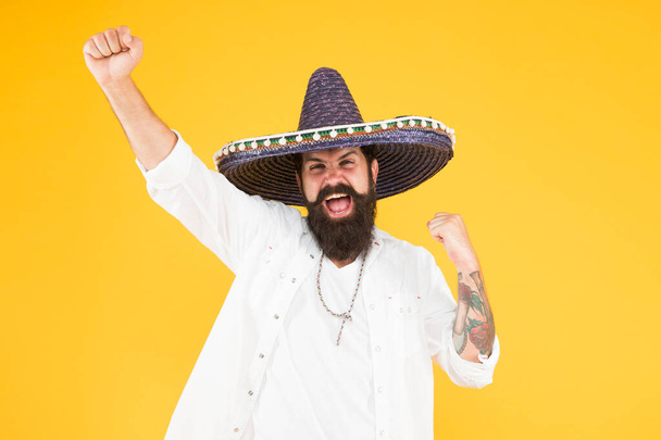 Mexican performer. Mexican traditions. Explore mexican culture. Celebrate traditional holiday. Happy man sombrero souvenir straw hat. Plan summer vacation. Festival concept. Hipster having fun - Valokuva, kuva