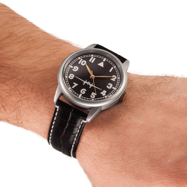 Wristwatch on hand on a white background - Foto, Bild