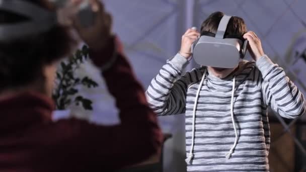 Diverse teens wearing VR glasses starting game - Video
