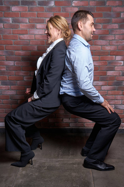 Business partners posing in yoga pose during break - Foto, immagini