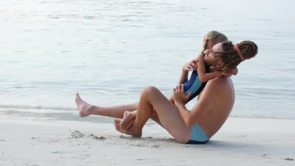 Dad and daughter spend time together and have fun on the beach, family values and care - Felvétel, videó