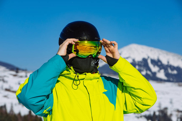 man in helmet and ski mask. reflection. winter activity - Photo, Image