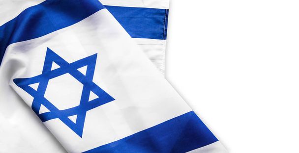 Close up shot of wavy blue and white Israeli flag. Happy independence day Israel, top view, flat lay. isolated on white background , copyspace. - Foto, afbeelding