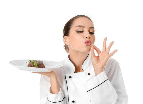 Bella chef femminile con gustosa carne su sfondo bianco
 - Foto, immagini