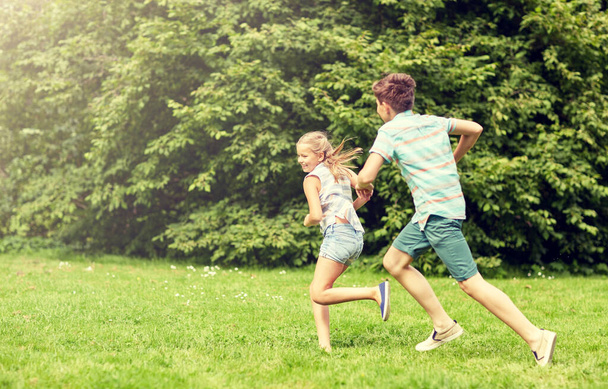 happy kids running and playing game outdoors - Zdjęcie, obraz