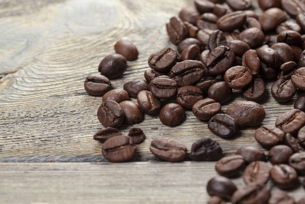 Coffee beans on wood background. Creative Photo - Zdjęcie, obraz