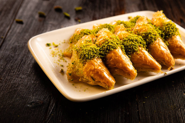 Turkish traditional dessert baklava with pistachio and walnut close up - Foto, Imagen