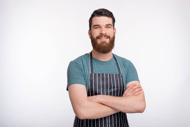Cooking courses figure. Portrait of a confident bearded cooker o - Foto, afbeelding