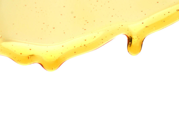 Sweet honey smear isolated on white background - Foto, afbeelding