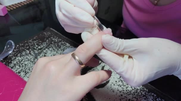 Manicurist manicures a woman in her arms. - Footage, Video