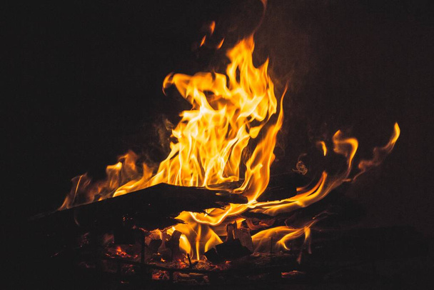 A closeup shot burning wood and the beautiful colors of fire - 写真・画像