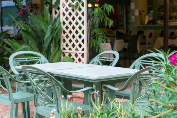 Outdoor cafe terrace exterior with chairs and tables. - Photo, Image
