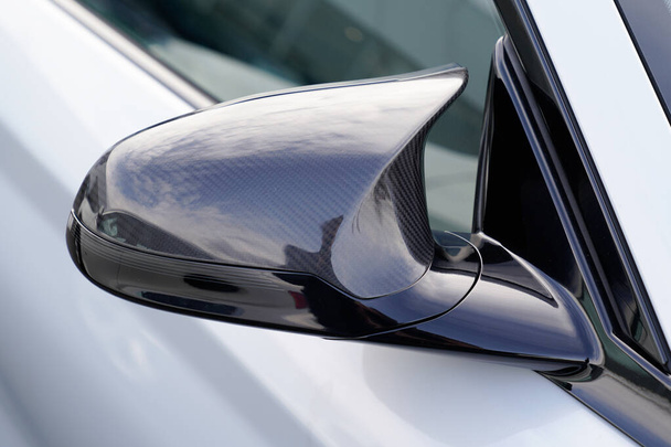 Close-up view of exterior sport car side mirror - Фото, изображение