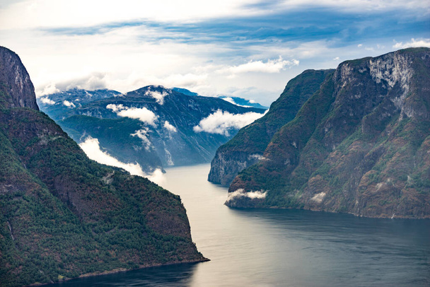 Aurlandsfjord fjord landscape with clouds over sea surface. Norway Scandinavia. National tourist route Aurlandsfjellet. - Φωτογραφία, εικόνα