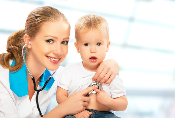 baby and doctor pediatrician. doctor listens to the heart with s - Photo, Image