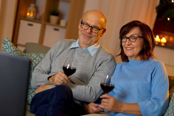 happy senior couple drink red wine and watch tv - Foto, Imagem