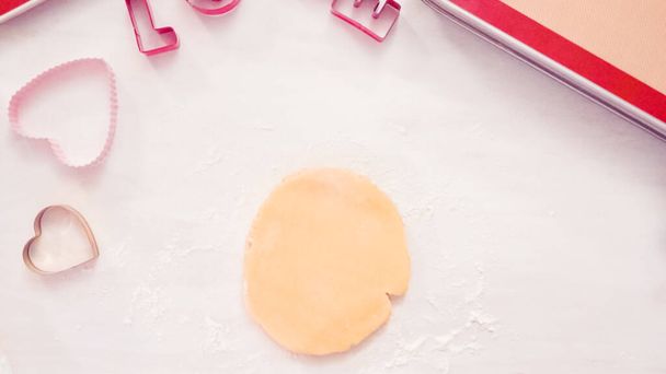 Flat lay. Step by step. Rolling sugar cookie dough with metal rolling pin. - Photo, Image