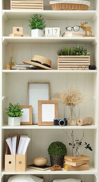 White shelving unit with different decorative elements - Foto, immagini